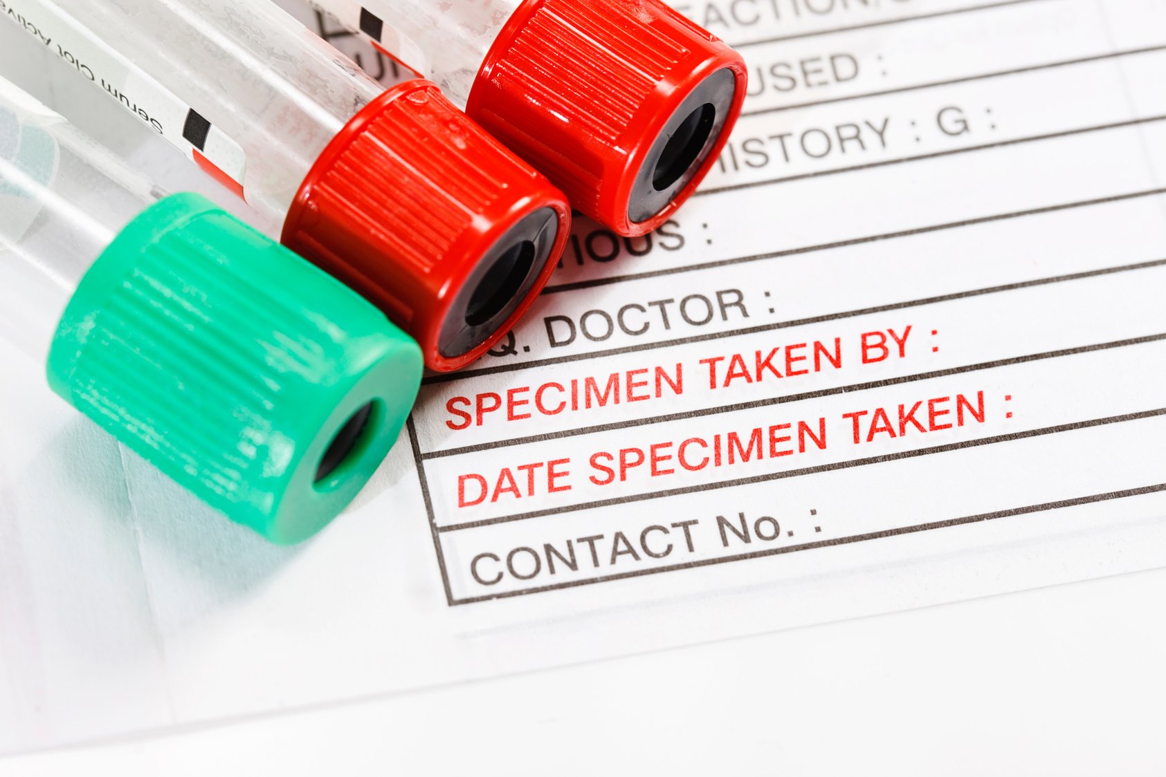 Blood specimen collection tubes on medical form ordering tests